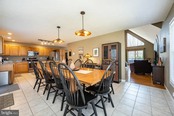 a bathroom with a bathtub and next to a window