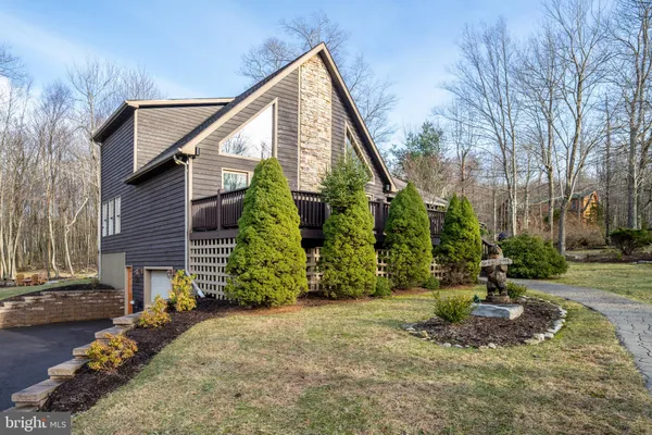 a view of a house with a yard and plants