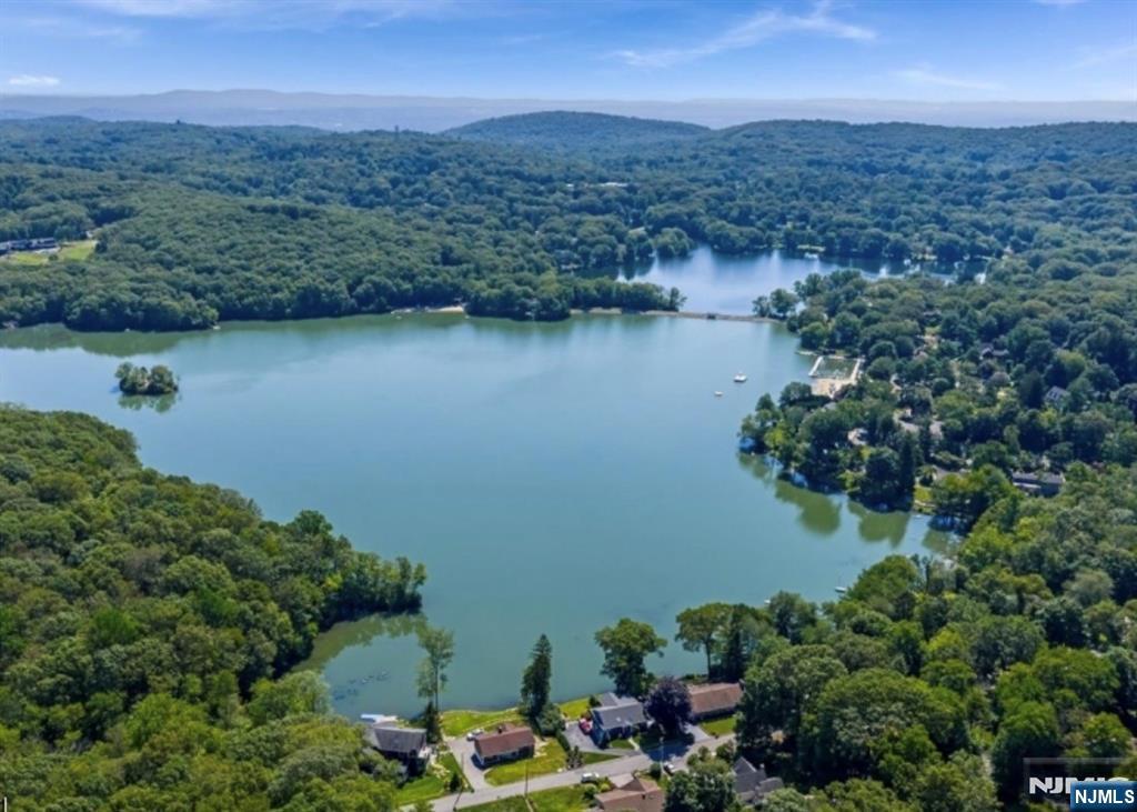 6 Waters Edge Butler, NJ 07405 - Photo 28 of 28 an aerial view of a house with a yard and lake view