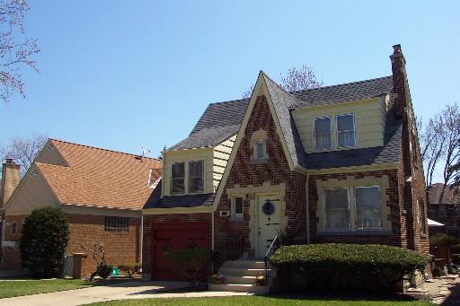 367 Longcommon Road Riverside, IL 60546 - Photo 1 of 1 a front view of a house with a garden