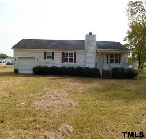 1199 Emmaus Church Road Dudley, NC 28333 - Photo 1 of 8 a front view of a house with a garden