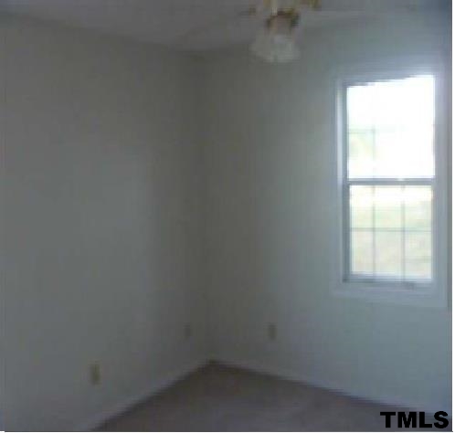 1199 Emmaus Church Road Dudley, NC 28333 - Photo 7 of 8 an empty room with a window