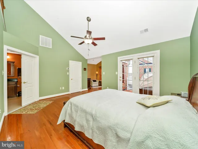 a bathroom with a granite countertop sink and a bathtub