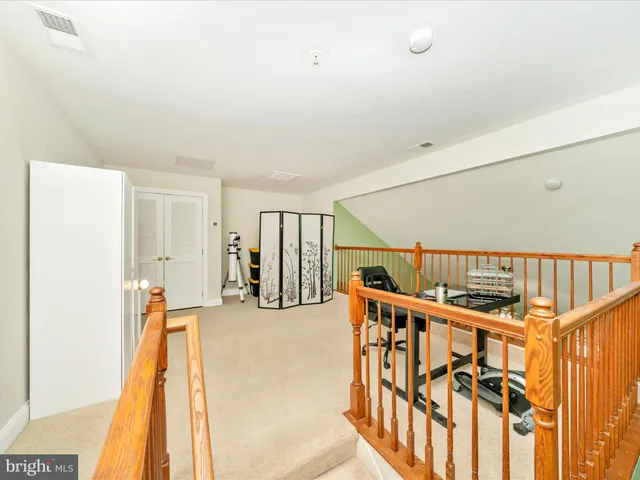 a bedroom with bed and window