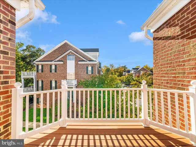 a front view of a house with outdoor seating