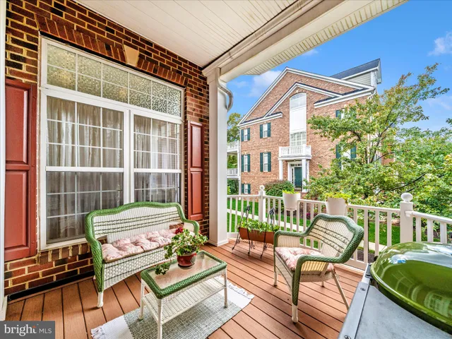front view of a brick house with a yard