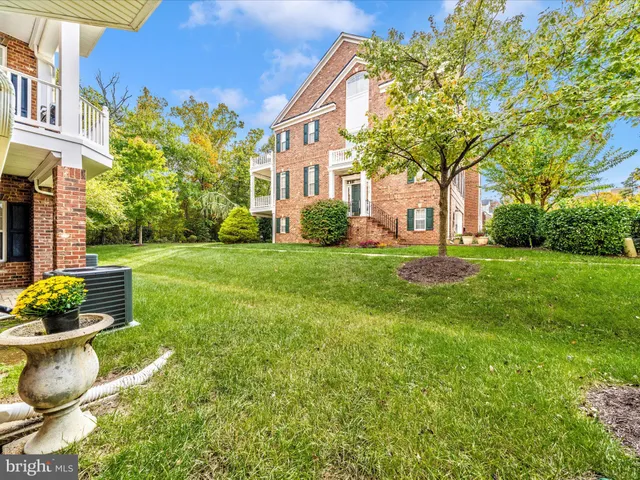 a view of a building with a yard