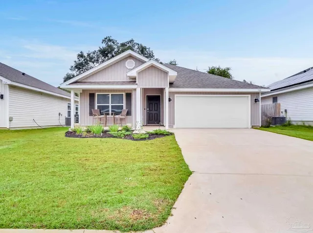 a front view of house with yard and green space