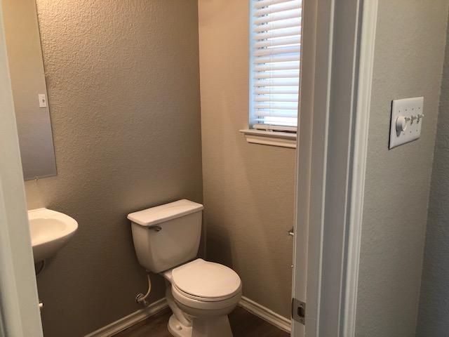 9217 Rowlands Sayle Road Austin, TX 78744 - Photo 13 of 18 A window brings natural light into this functional half bath.