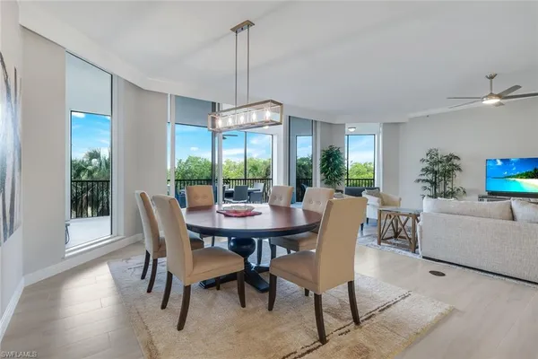 a view of a dining room with furniture window and outside view