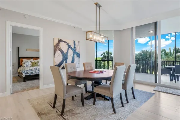 a view of a dining room and a table chairs