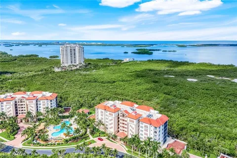 a view of a swimming pool with a yard
