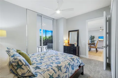 a bedroom with a bed and a dresser in it