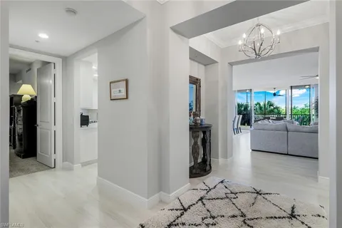 a dining room with furniture window and wooden floor