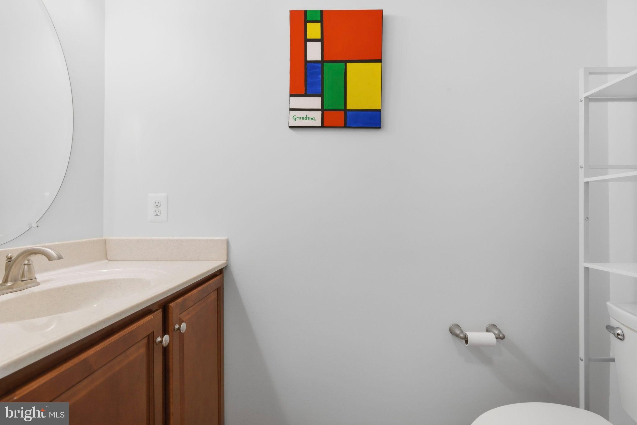 900 East Wheel Road Bel Air, MD 21015 - Photo 15 of 54 Vibrant art enhances a modern bathroom space.