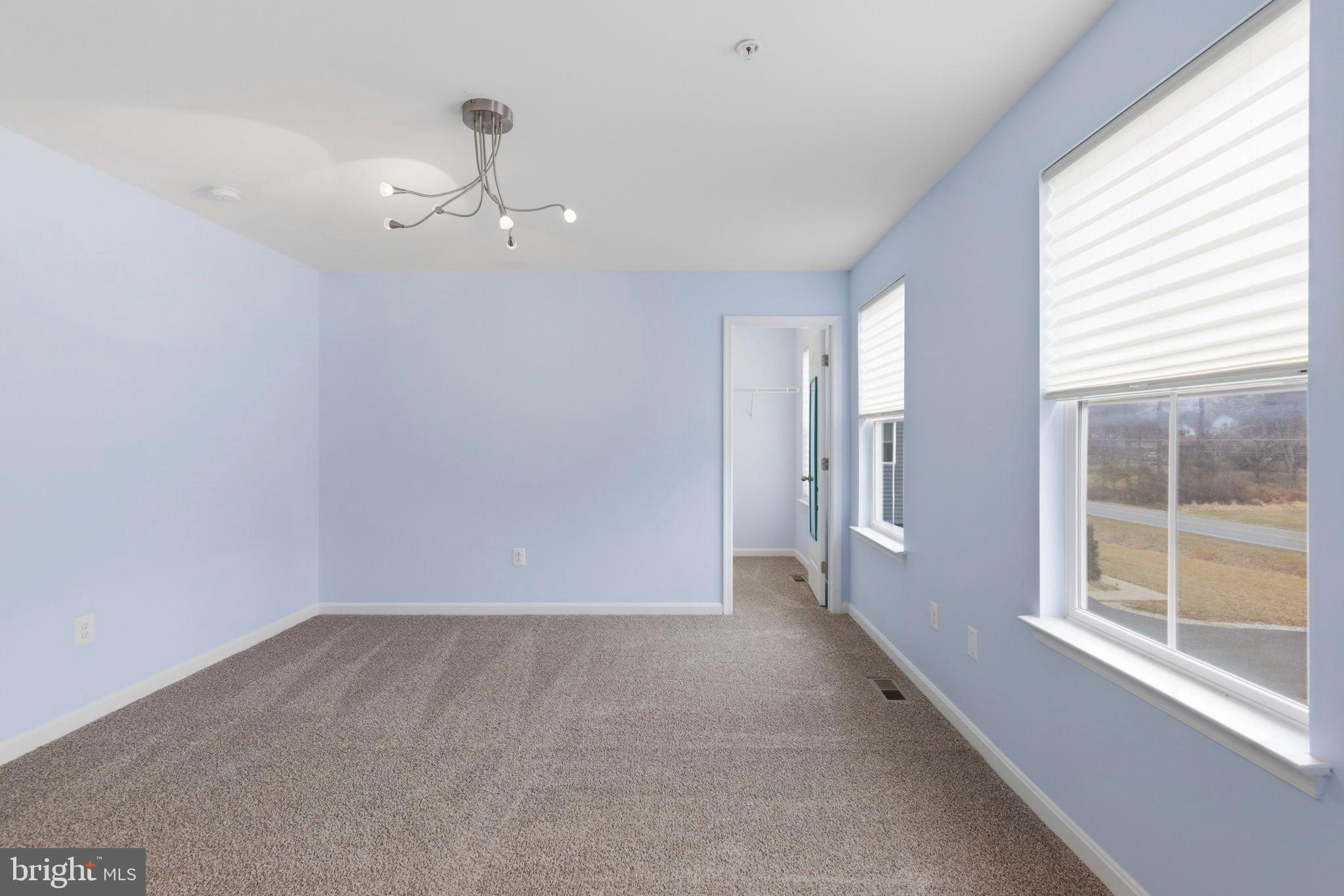 900 East Wheel Road Bel Air, MD 21015 - Photo 30 of 54 Bright and airy room with soft blue hues.