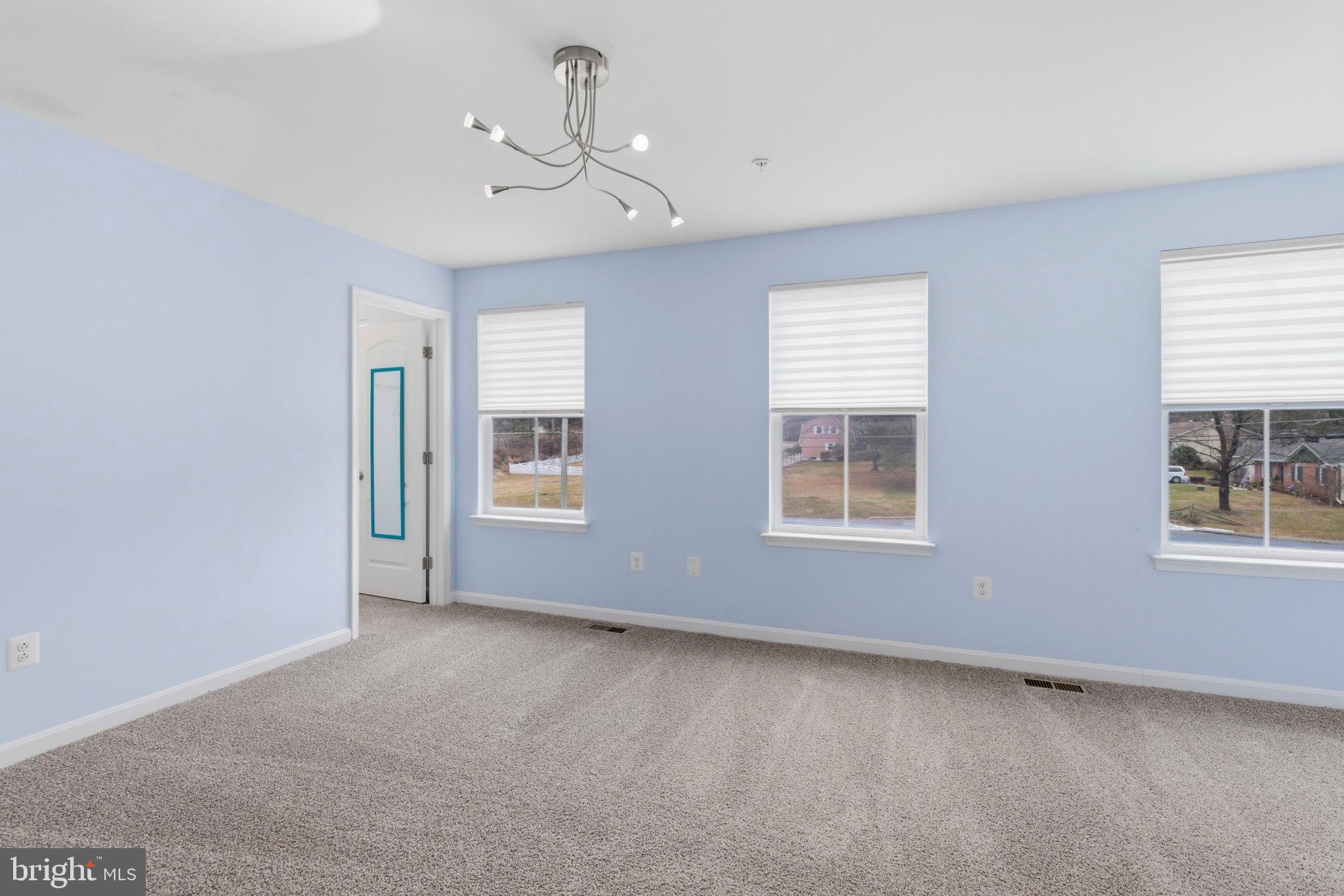 900 East Wheel Road Bel Air, MD 21015 - Photo 31 of 54 Bright and airy room with soft blue walls.