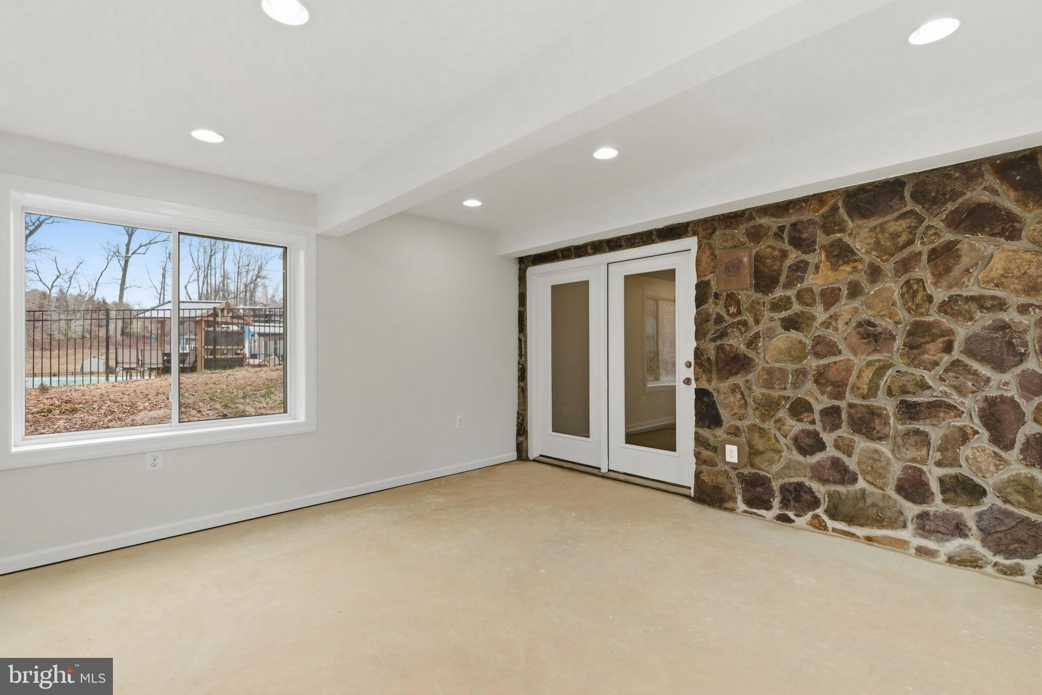 900 East Wheel Road Bel Air, MD 21015 - Photo 40 of 54 Bright, airy space with rustic stone accents.