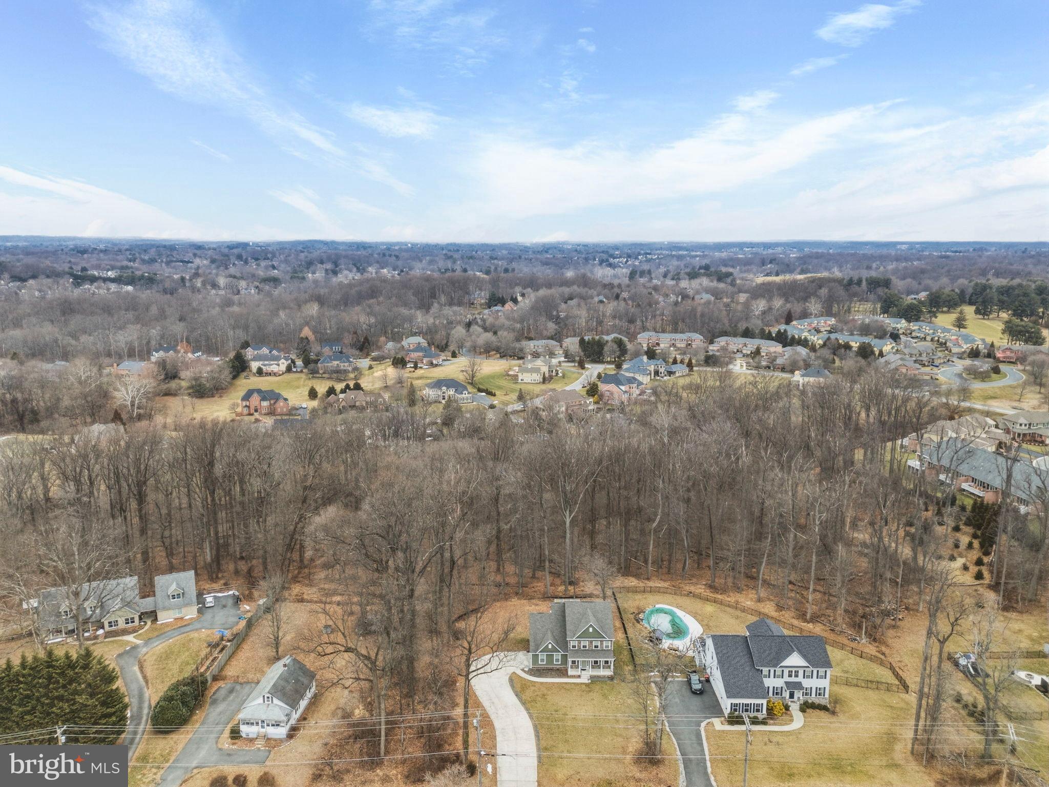 900 East Wheel Road Bel Air, MD 21015 - Photo 49 of 54 Serene suburban landscape with wooded backdrop.