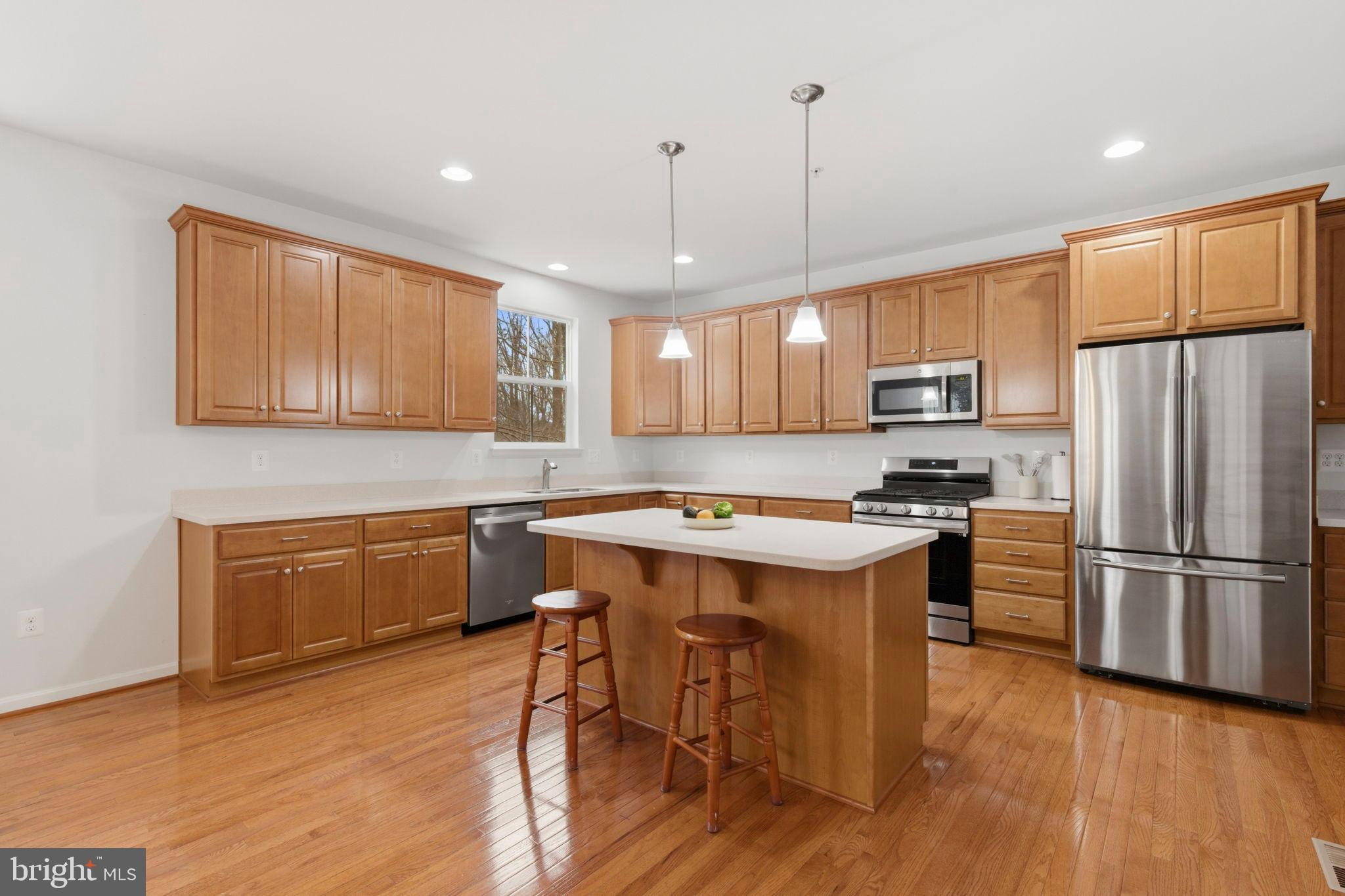 900 East Wheel Road Bel Air, MD 21015 - Photo 7 of 54 Modern kitchen with warm wood accents.