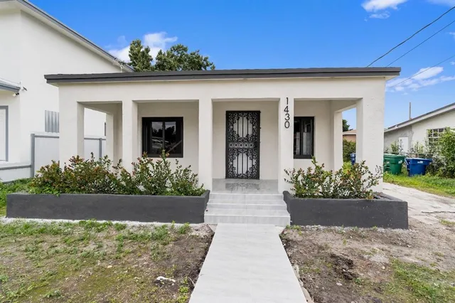 front view of a house with a yard