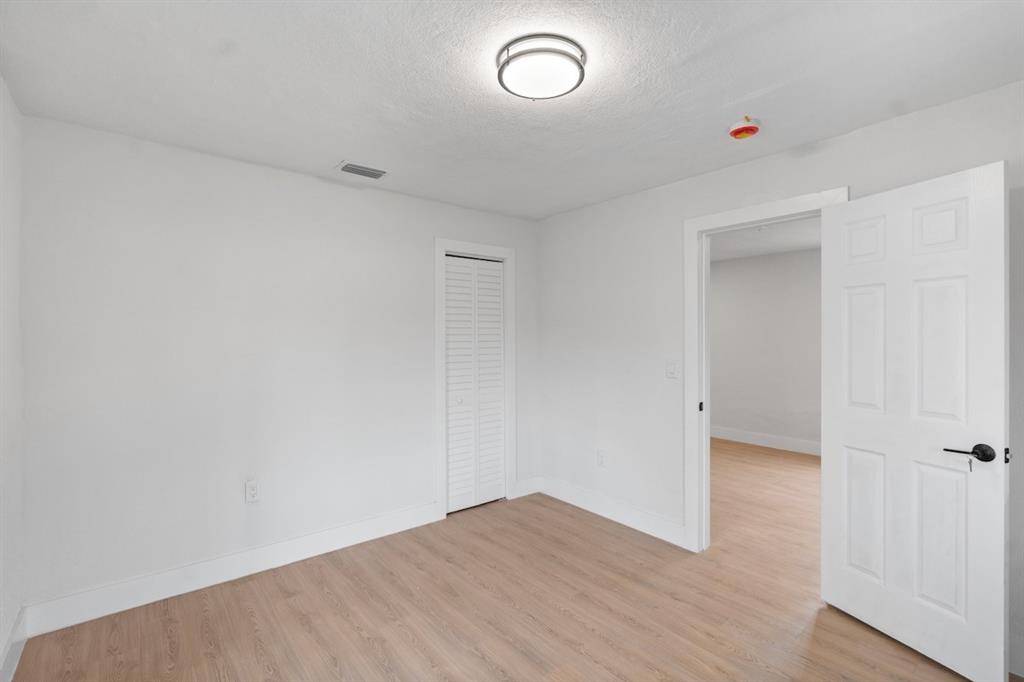1430 Northwest 74th Street Miami, FL 33147 - Photo 25 of 29 a view of an empty room