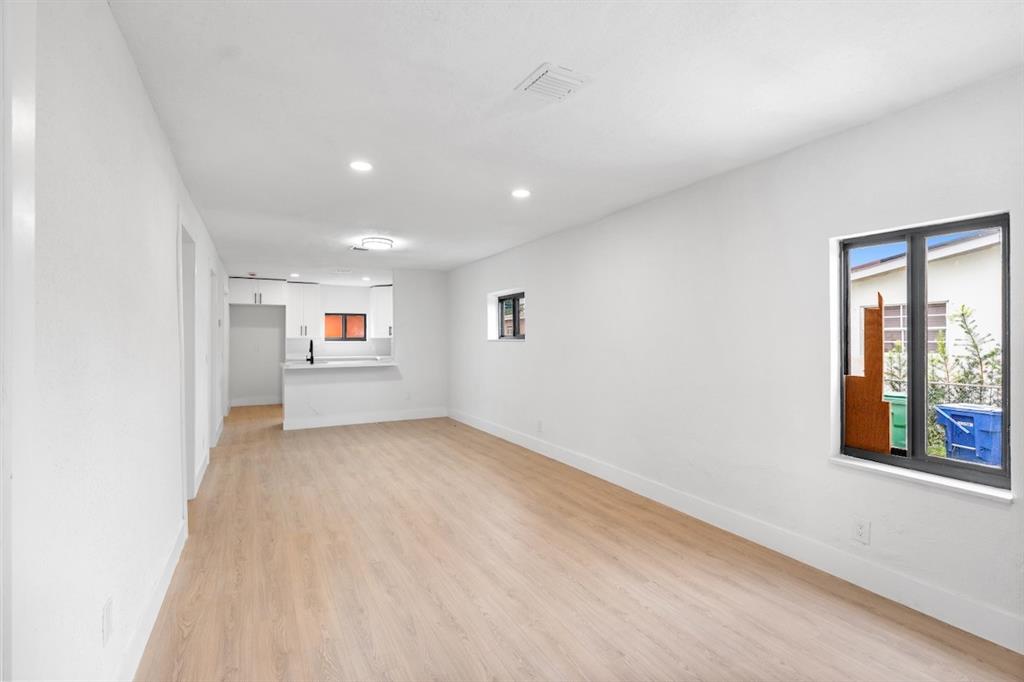 1430 Northwest 74th Street Miami, FL 33147 - Photo 6 of 29 a view of a big room with windows and cabinet