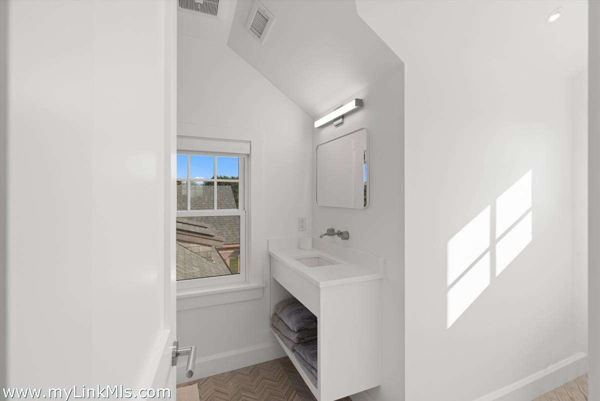3 Tautemo Way Nantucket, MA 02554 - Photo 53 of 57 a en suite bathroom with a sink a washer and dryer