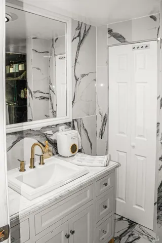 a bathroom with a sink and a mirror