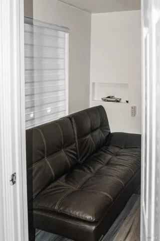 a view of a balcony with a couple of potted plants