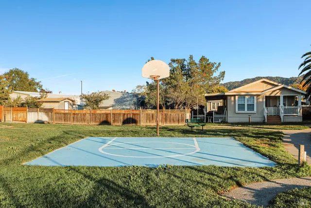 a view of yard with basketball court