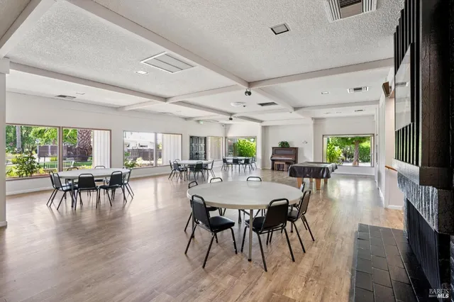 a room with gym equipment and a large window