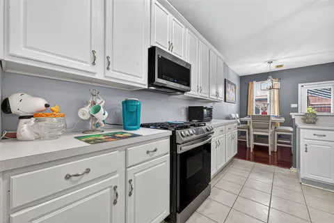 a kitchen with stainless steel appliances a refrigerator and cabinets