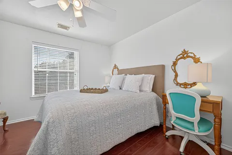 a bedroom with furniture and a window