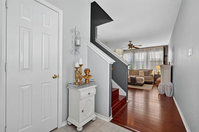 a bathroom with a granite countertop sink a mirror and a bathtub