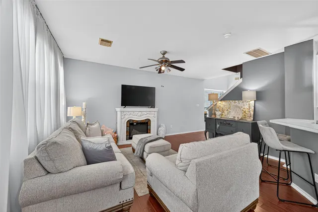 a living room with furniture and kitchen view
