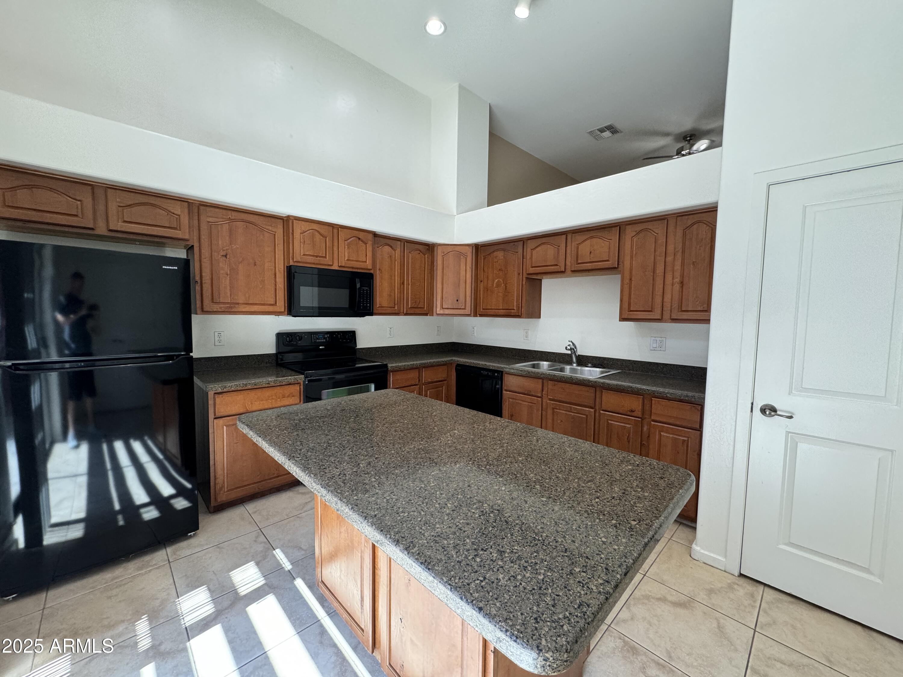 305 South Wilson Street, Unit 111 Tempe, AZ 85281 - Photo 2 of 48 a kitchen with stainless steel appliances granite countertop a refrigerator and a sink