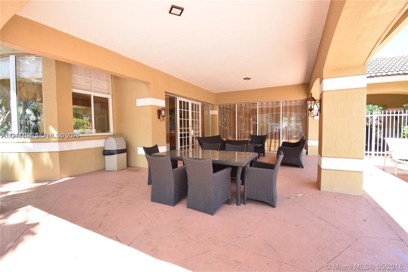 470 South Park Road, Unit 7306 Hollywood, FL 33021 - Photo 9 of 20 a view of a living room and kitchen with a large window