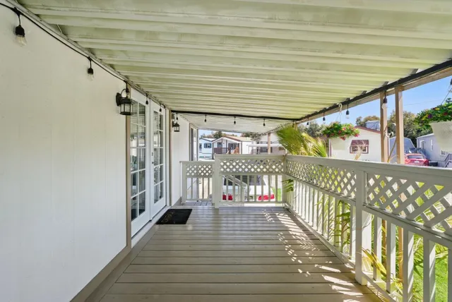 a view of a porch with wooden floor