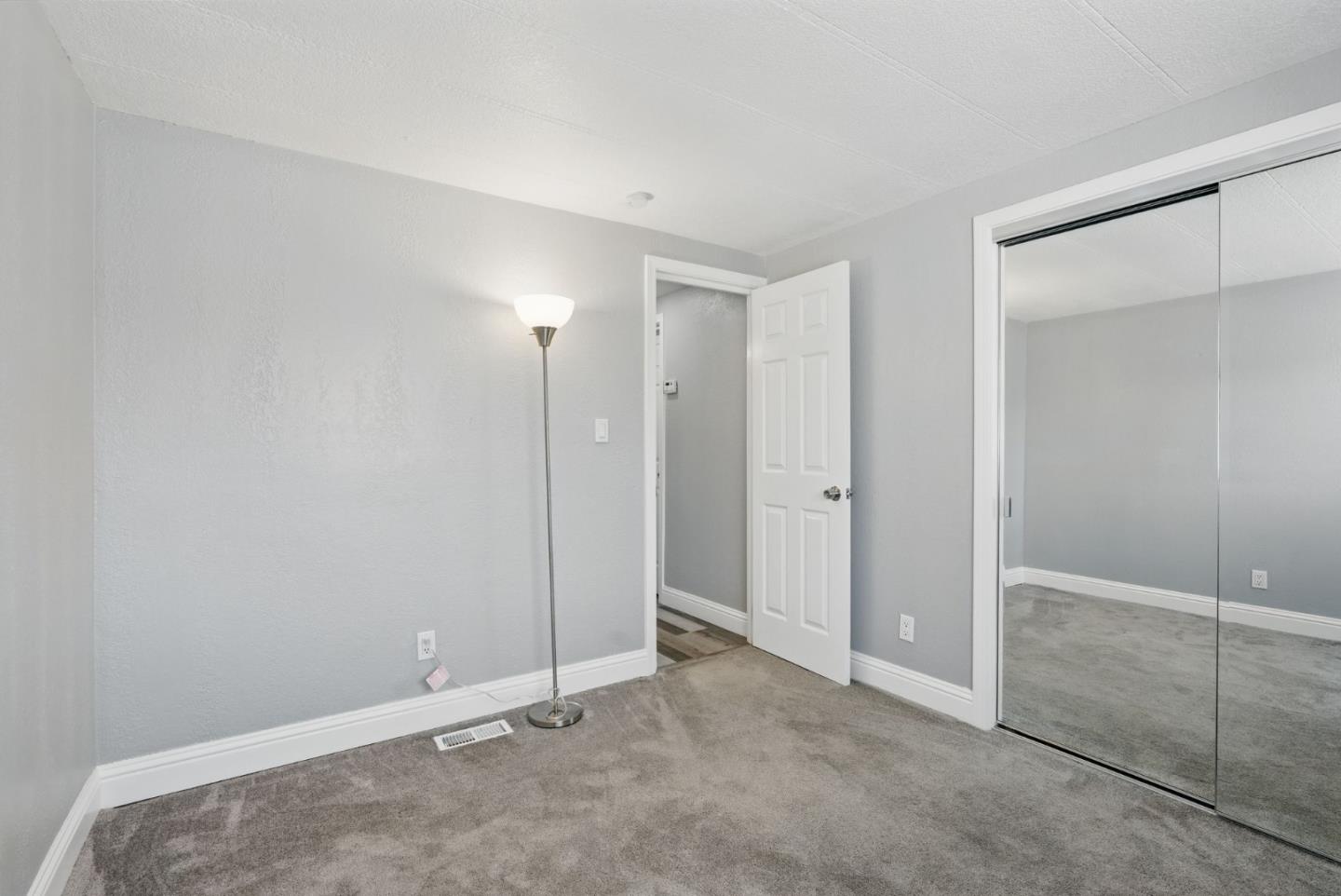 3015 East Bayshore Road, Unit 169 Redwood City, CA 94063 - Photo 2 of 30 an empty room with sliding door