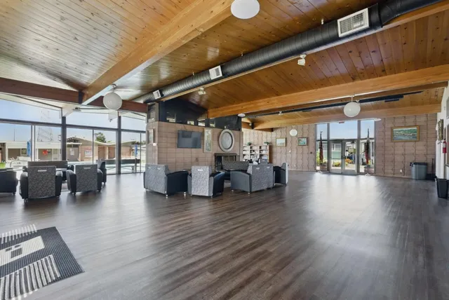 a view of a studio with wooden floors