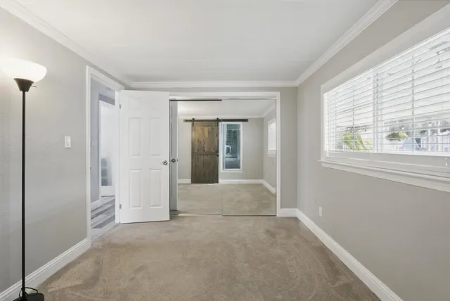 a view of an empty room with a window