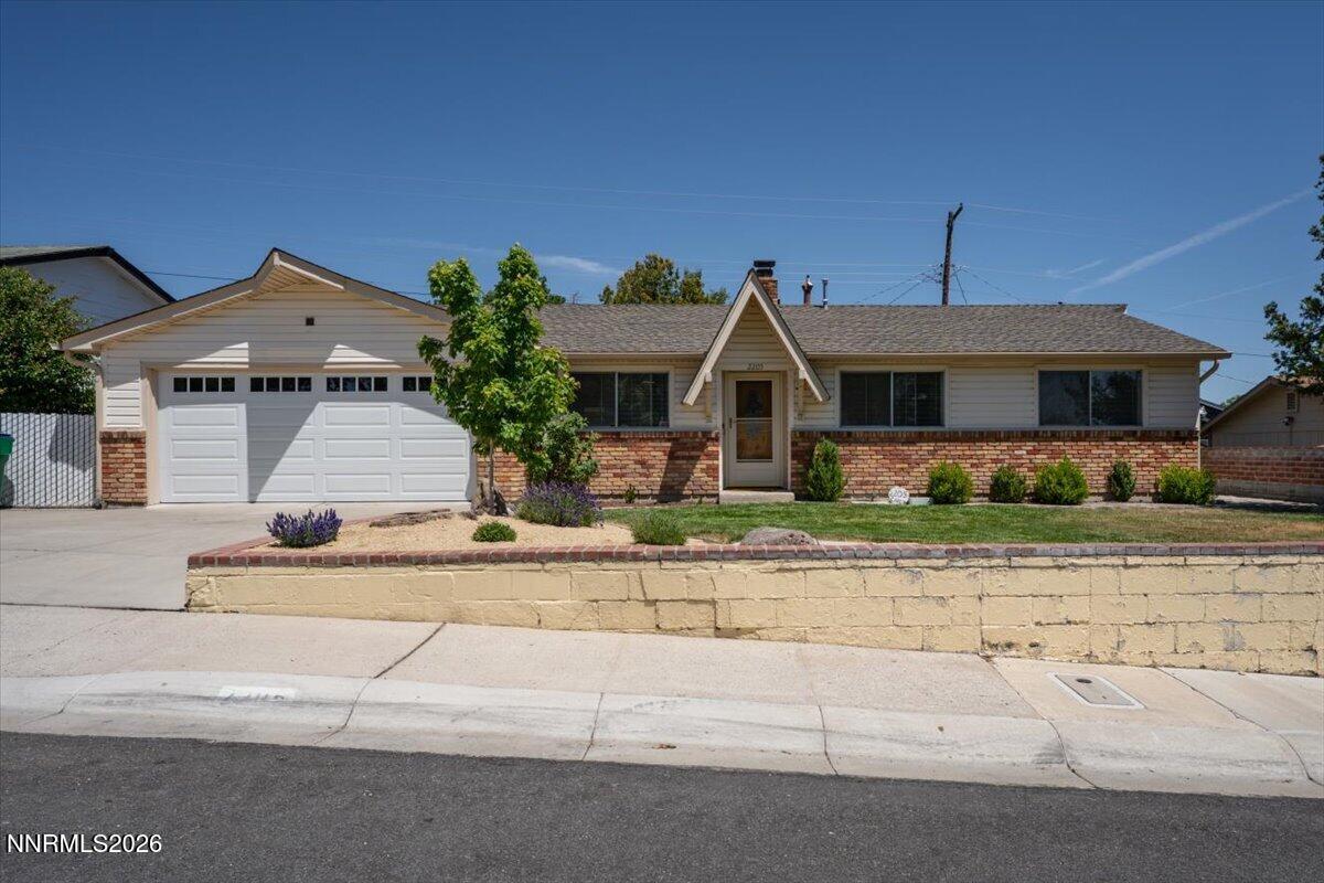 2205 Carlin Street Reno, NV 89503 - Photo 32 of 51 front view of a house with a small yard