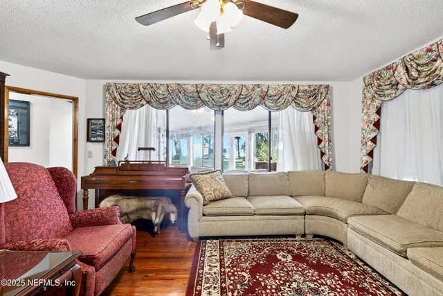 a spacious bathroom with a granite countertop sink and a mirror