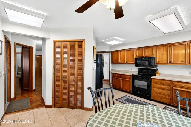 a living room with furniture and a book shelf