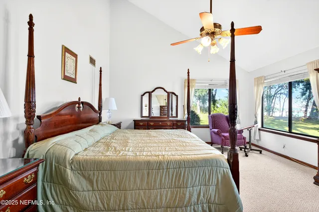 a bedroom with a bed and a bookshelf