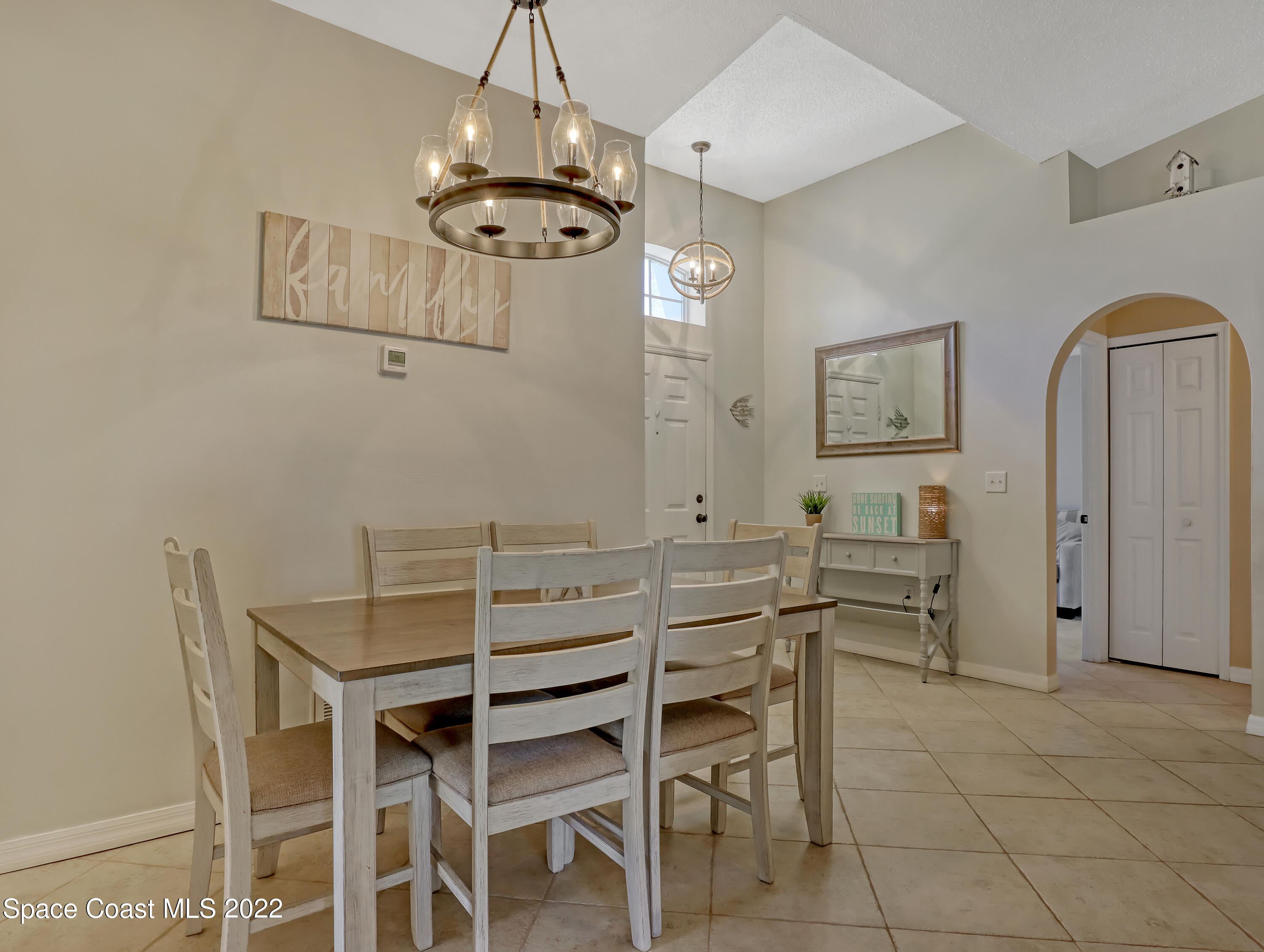 4920 Spinet Drive Melbourne, FL 32940 - Photo 13 of 44 a view of a dining room with furniture
