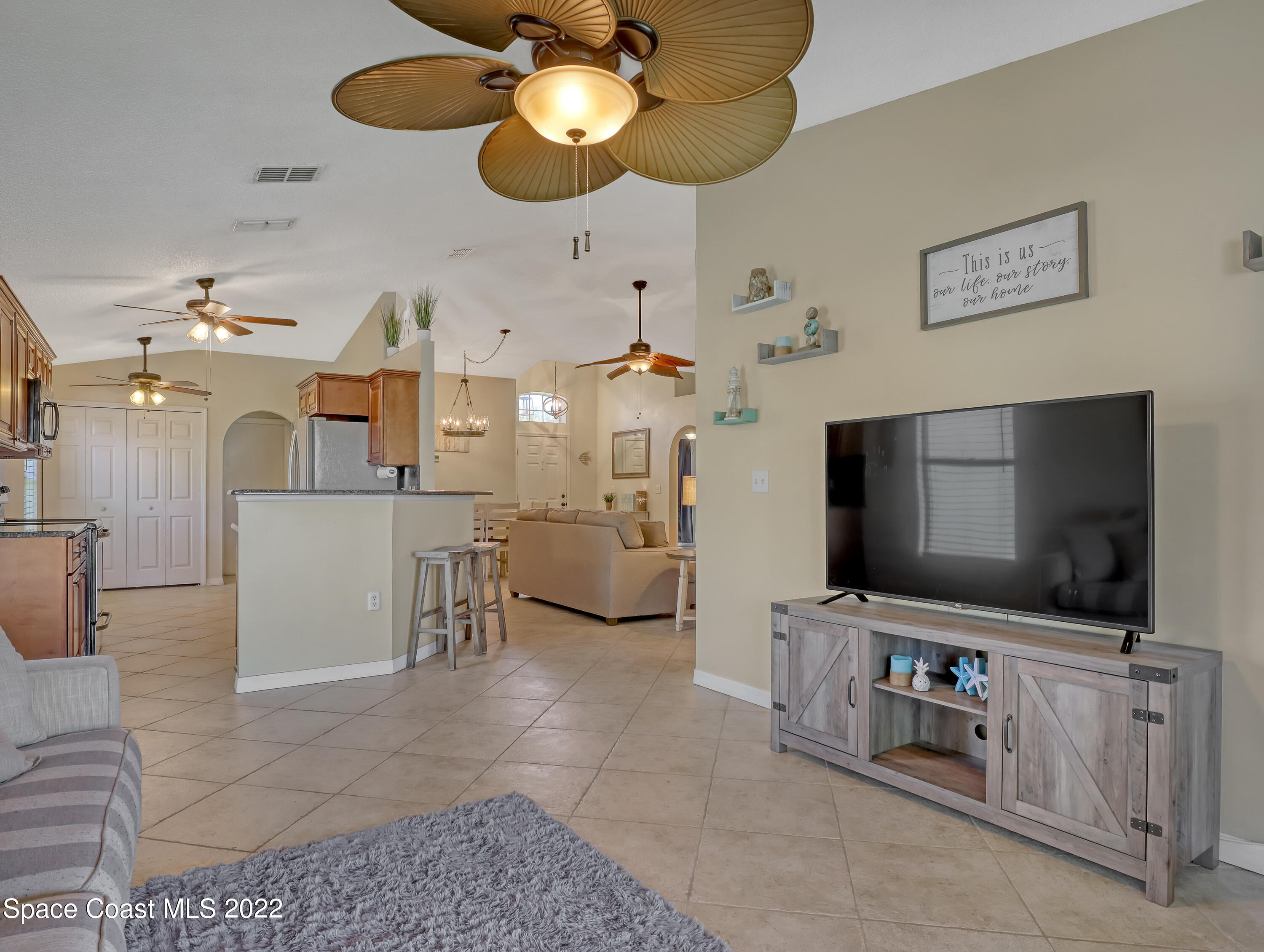 4920 Spinet Drive Melbourne, FL 32940 - Photo 14 of 44 a living room with furniture and a flat screen tv