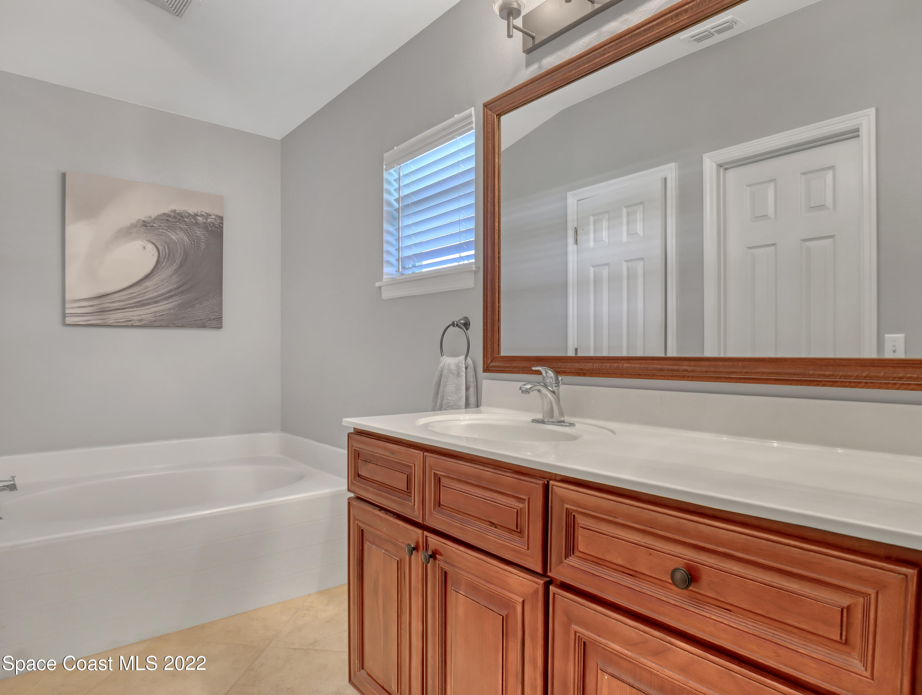 4920 Spinet Drive Melbourne, FL 32940 - Photo 20 of 44 a bathroom with a sink and a bathtub