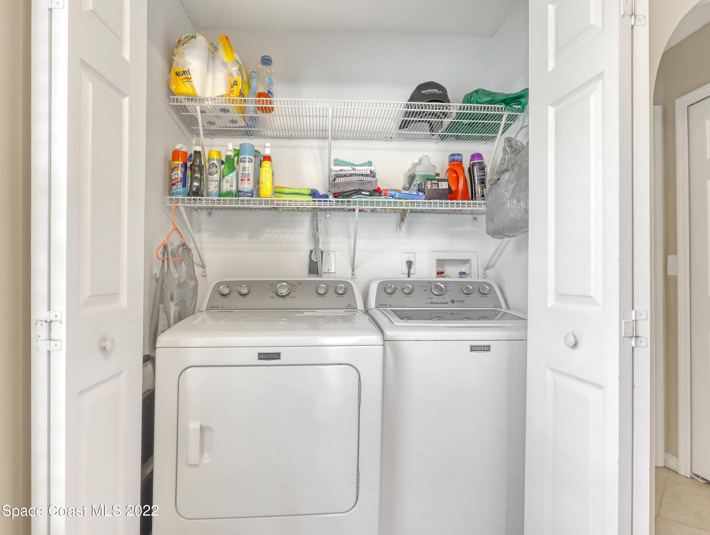 4920 Spinet Drive Melbourne, FL 32940 - Photo 26 of 44 a utility room with dryer and washer